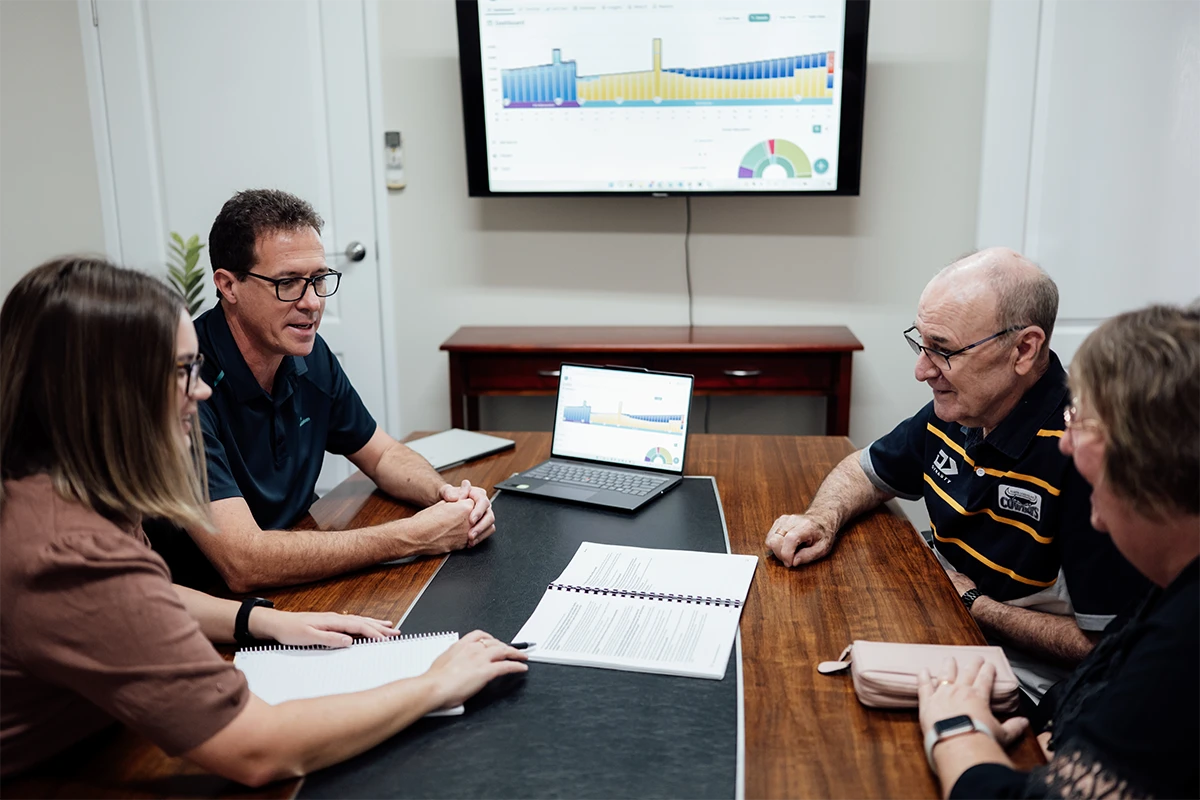 Financial advisers meeting with clients to review a retirement plan